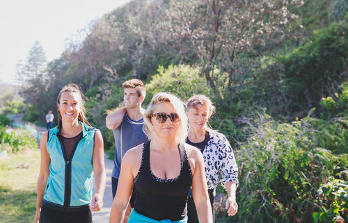 a group of people walking outdoors