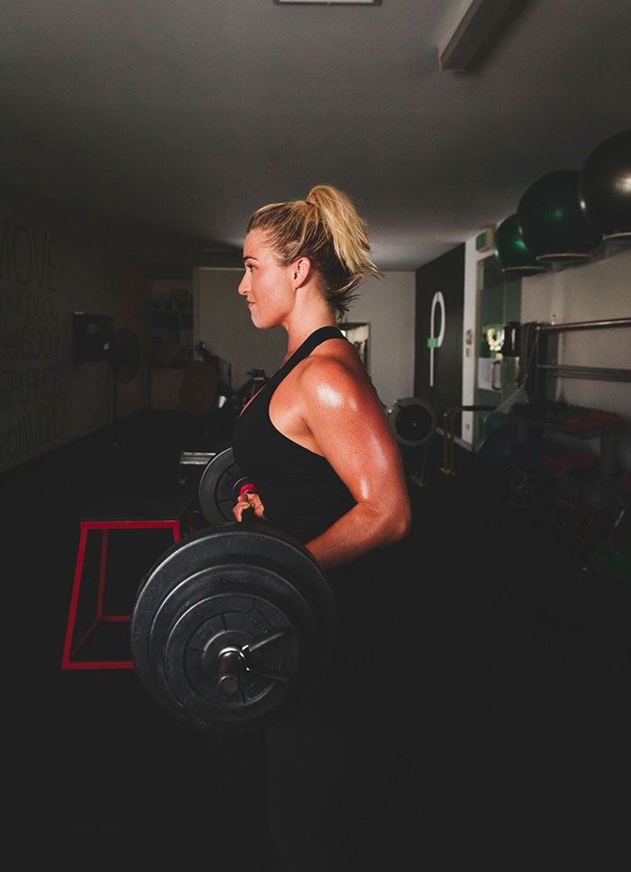 161023-perfect-fit-trainers-newport-beach-113-edit a woman doing strength training exercise using weights