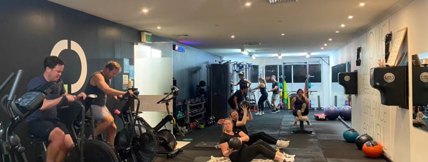 indoor fitness gym with group of people doing their fitness session