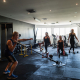 indoor fitness gym with group of people doing their workout